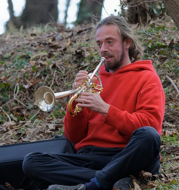 Man practicing guitar showing the unglamorous repetition that eventually
