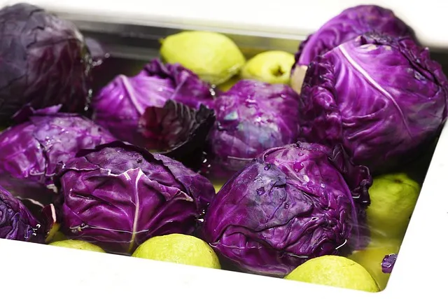 washing produce, produce, vegetables, purple cabbages, guava