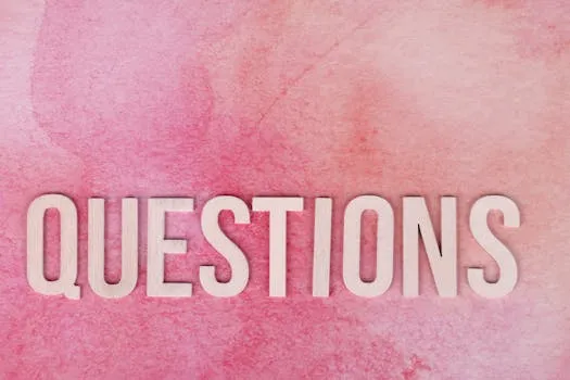 Wooden QUESTIONS text on pink watercolor background, perfect for design and