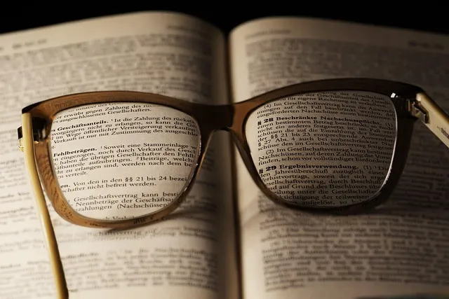 a book, paper, document, poetry, side, literature, writing, reading glasses,