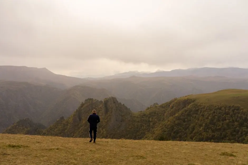 Man alone mountain ridge