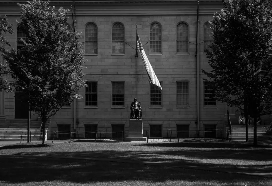Harvard behind man